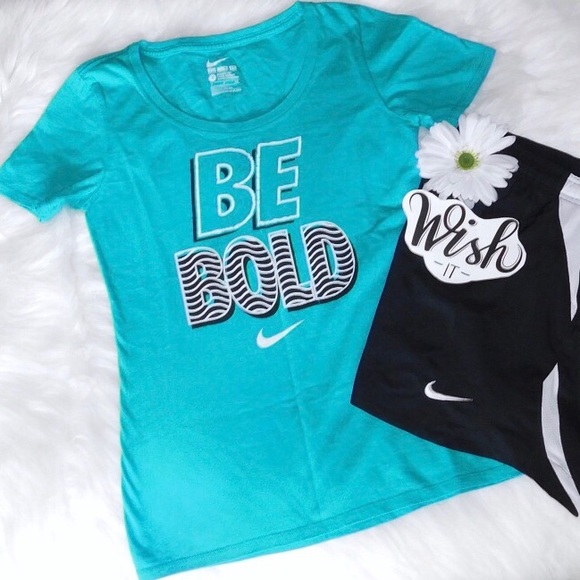 white and turquoise nike shirt